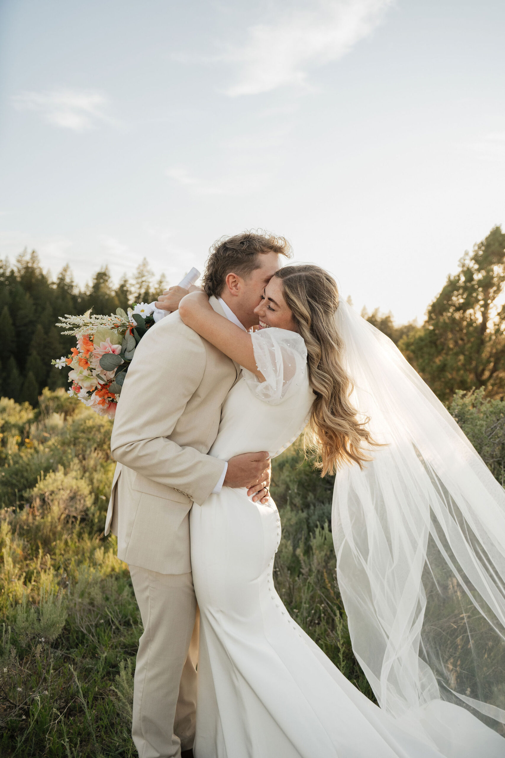 Photo of bride and groom embracing in Southeast Idaho mountains for a bridal session with Bailee Freeman Photography