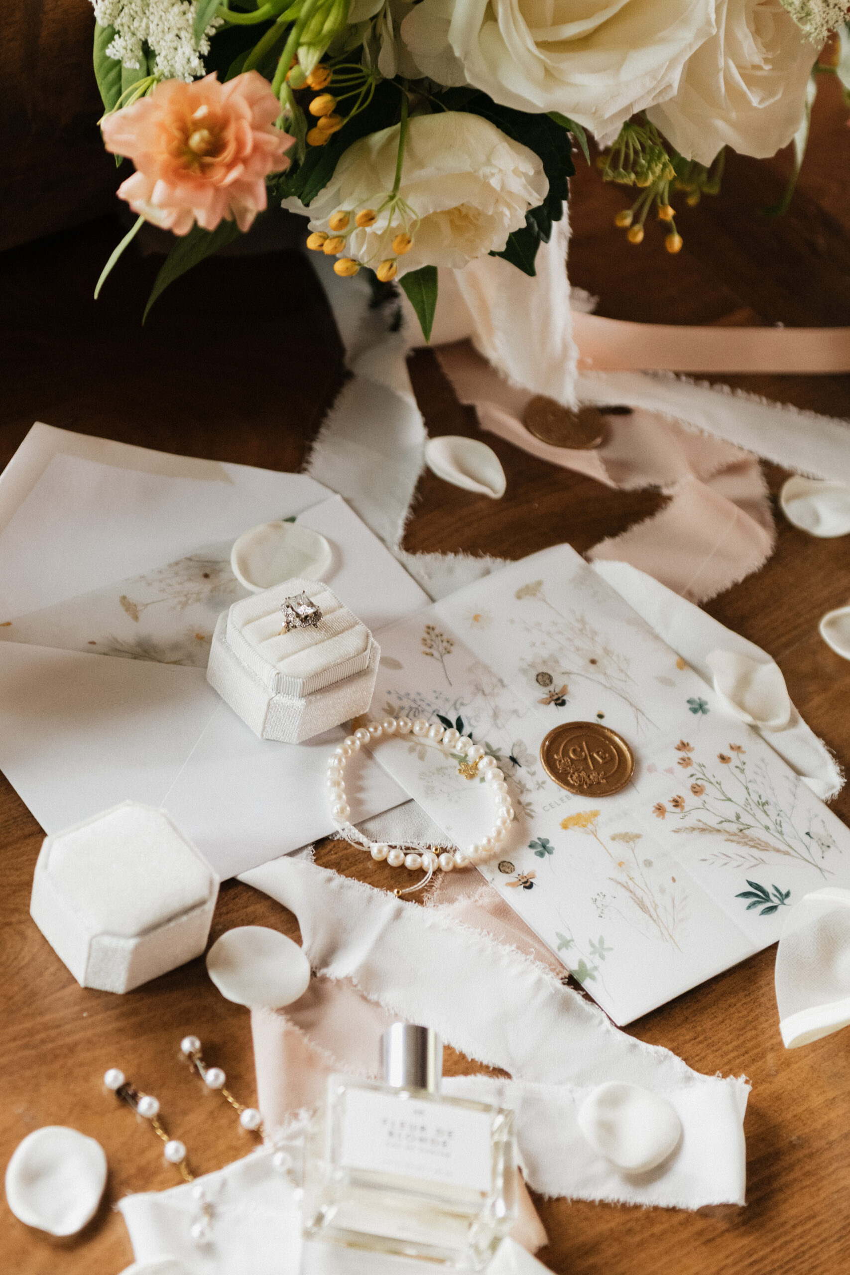 White and peach wedding details flatlay in Ashton, Idaho